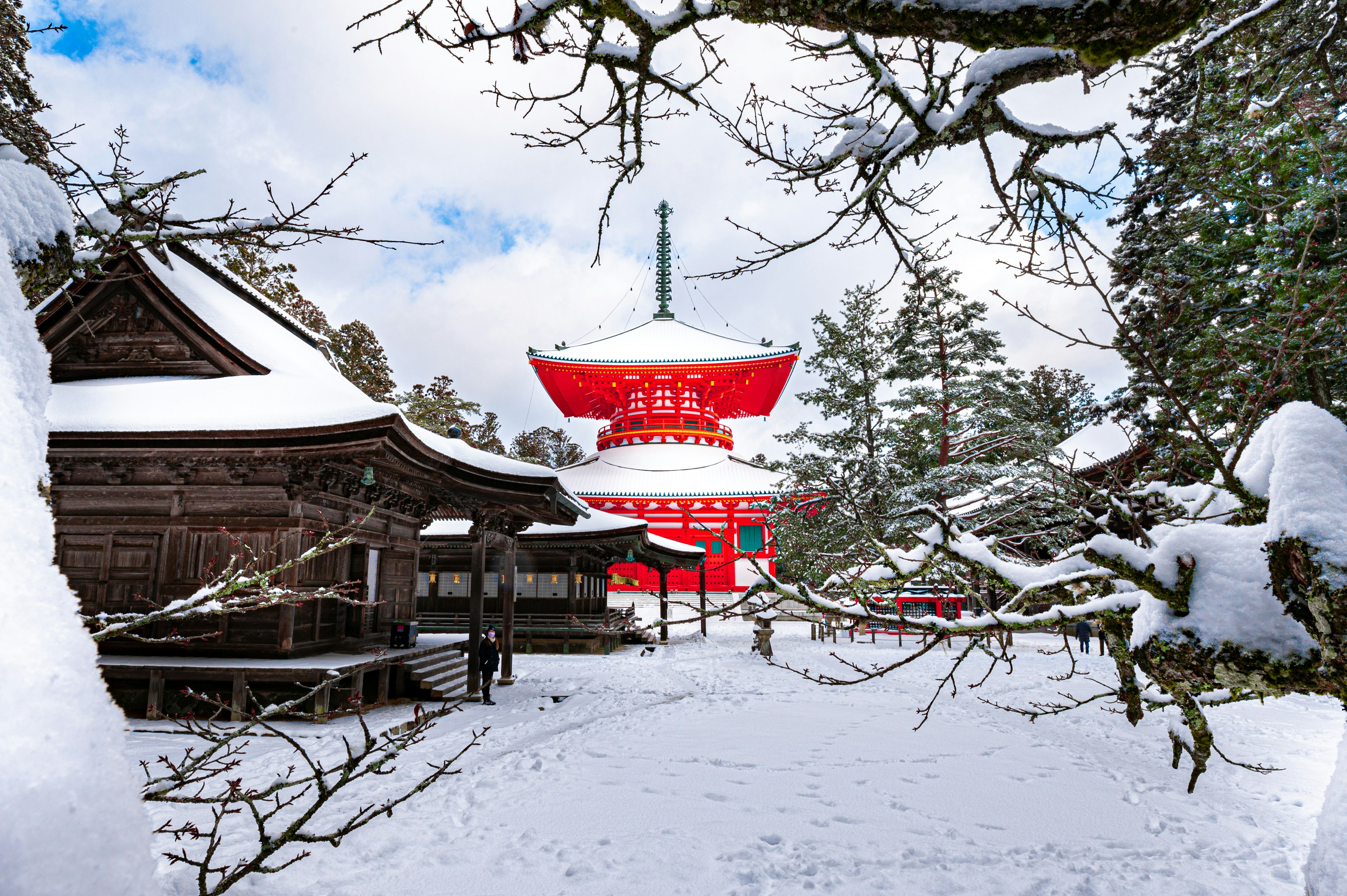 Red pagoda in snow at Mount Koya